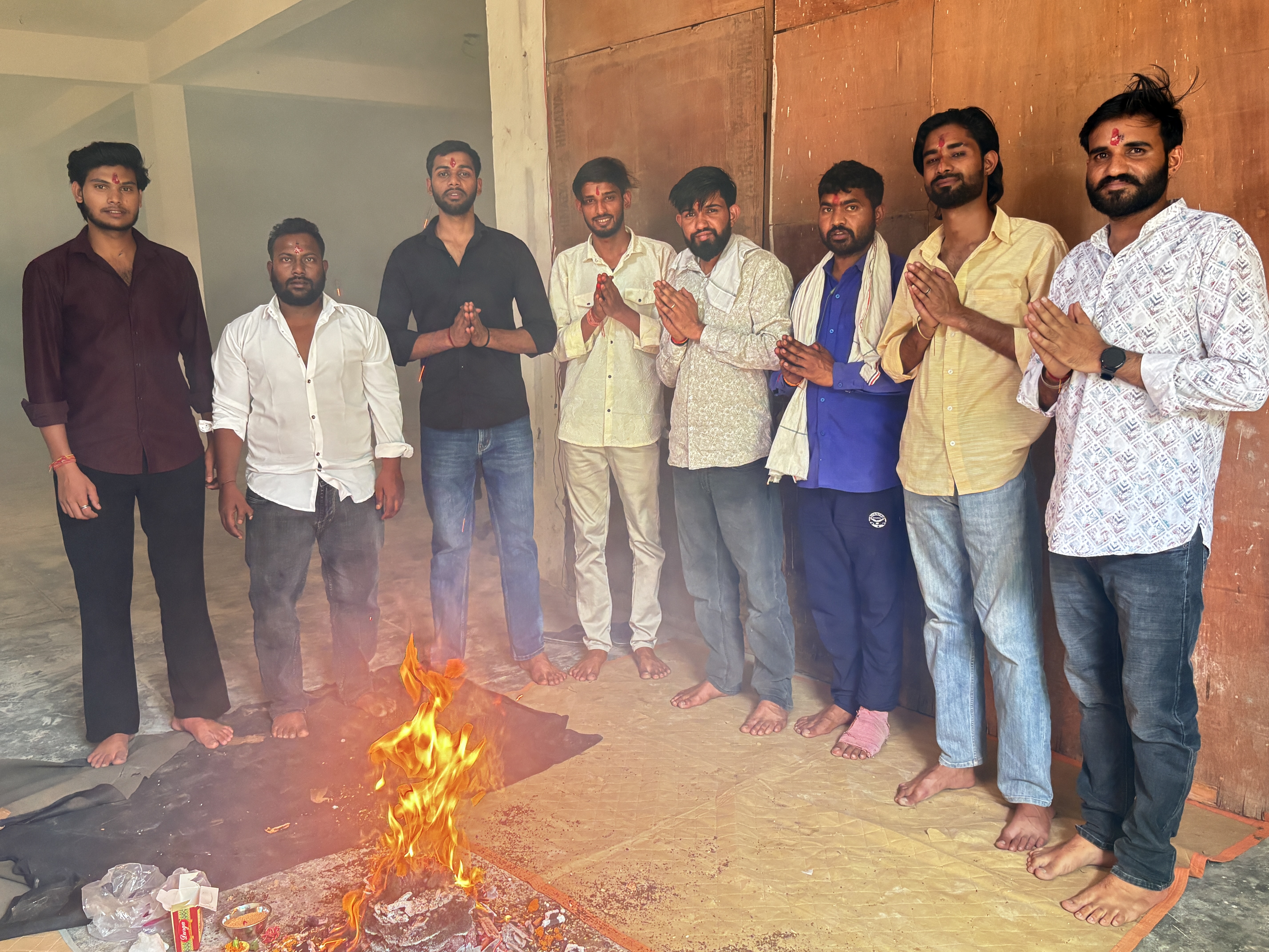Rahul Gurjar with his team around a bonfire